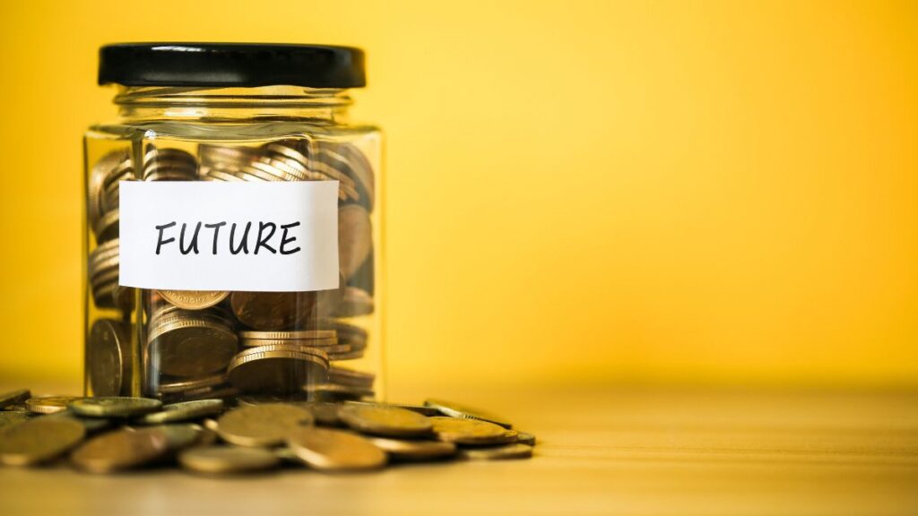 a savings jar full of coins with a tag that reads "future"