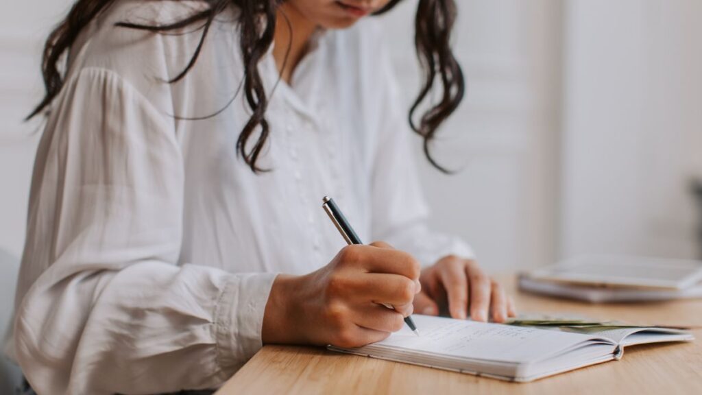 a woman creating using the zero-based budgeting technique