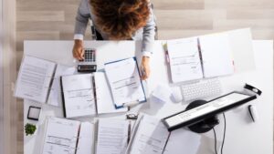 a small business owner performing a mid-year financial check-in