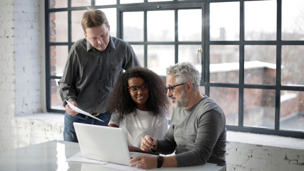 Small business owner working with a team preparing finances for the fall season