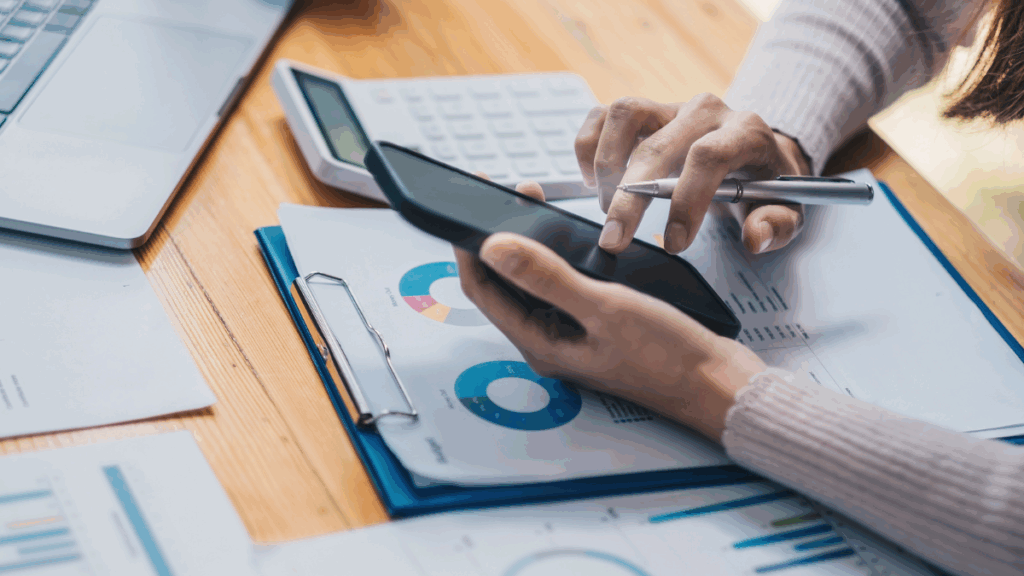 Small business owner reviewing financial reports