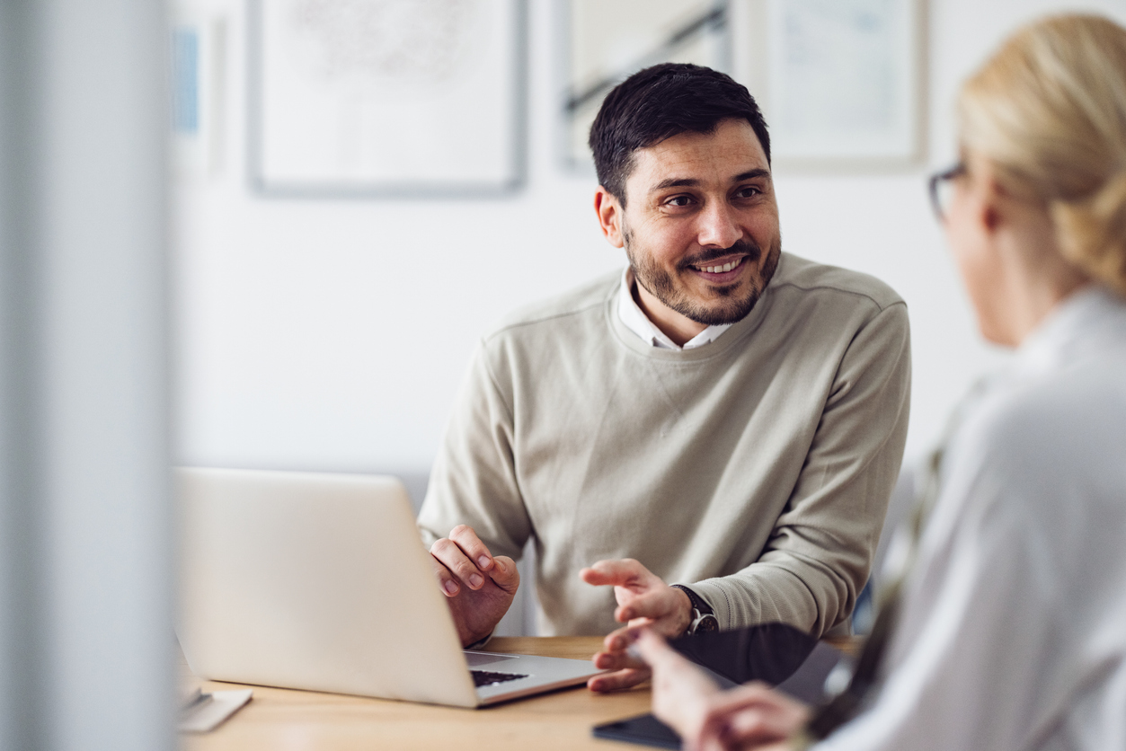 A Numble accountant reviewing payroll with a small-business owner