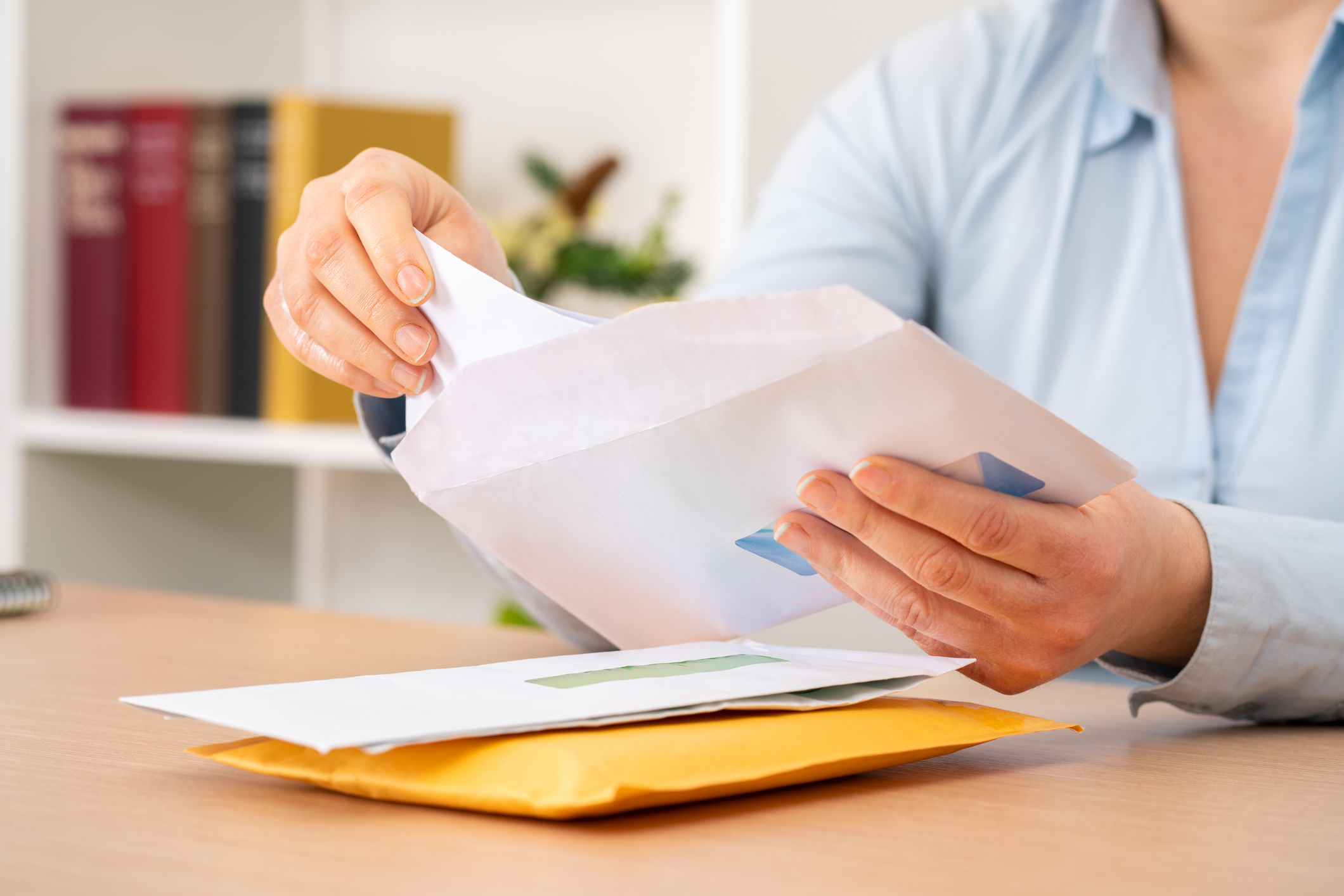 A St. Albert business owner reviewing a CRA letter calmly with a Numble accountant